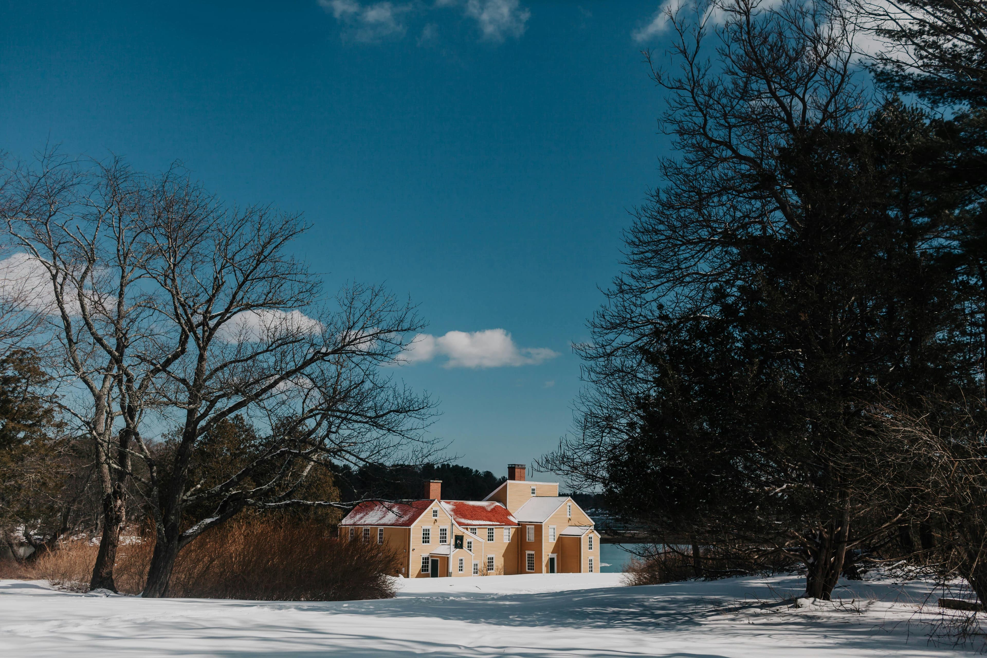 New England farmhouse compound in winter